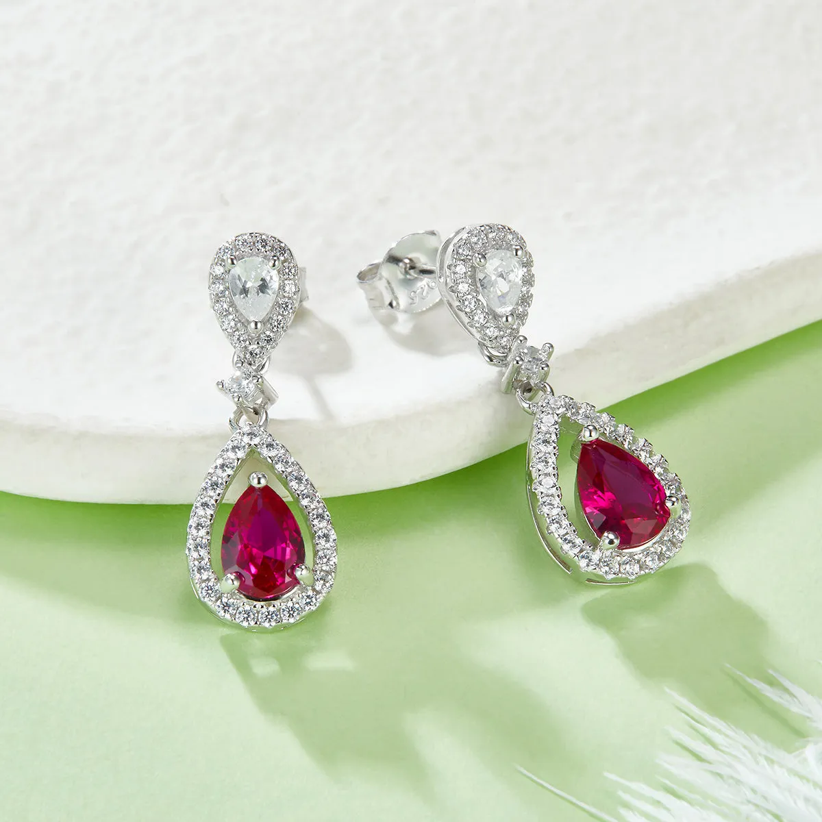 0.8 Carat Pear Shaped Lab Created Ruby Halo Drop Earrings in S925 Silver Plated Platinum